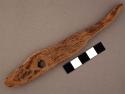 Wood fragment, long and thin with handle, with perforation