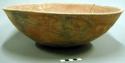 Bowl. outcurved. rounded bottom, interior-exterior polishing striations, fire-cl