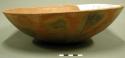 Outcurved bowl; rounded base, repaired body, fireclouds, interior-exterior polis