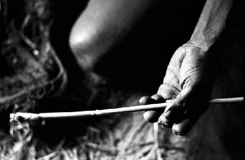 Women's hands holding a cigarette holder