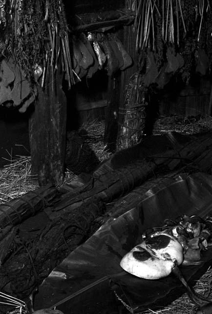 Meat on a banana leaf in back of the honai near the hakok or cupboard where the holy stones are kept