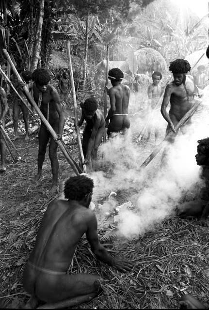 Men bring stones over to keep building up the hakse