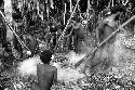 Men bringing hot stones to put in the hakse