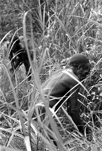 Polik hunting for mice a day after the wam kanneké; these will be eaten to lift the taboo ban which is on the whole group for having had this very important ceremony