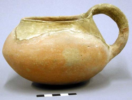 Pitcher. shouldered: medial; wide mouth handle & rim restored. rounded base. plu