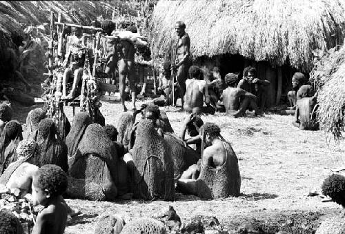 Pigs brought into sili with the pia in the middleground and women in the foreground