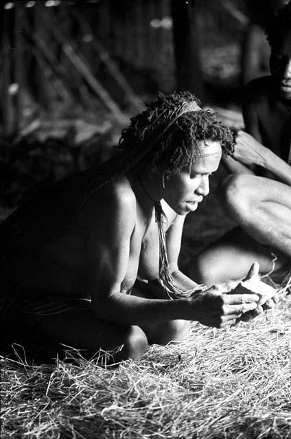 Woman with sweet potato in a hunu