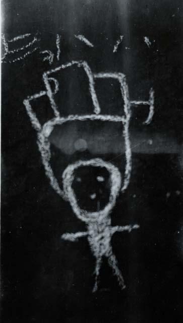 Petroglyph of man with head dress (chalked)