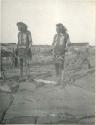 Two Hopi men watching race on the morning of the Snake Dance at Oraibi