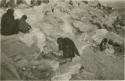 Hopi woman scattering sacred meal, early morning ceremony at Hoteville