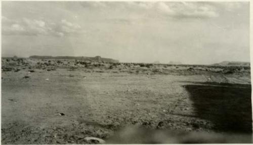 View looking south from Rock Point Store, with two mesas in background