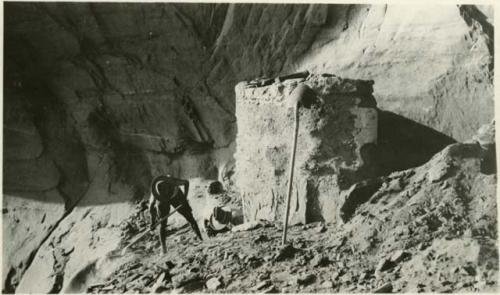 Man digging where Basketmaker sandal was found next to round tower at Site 4