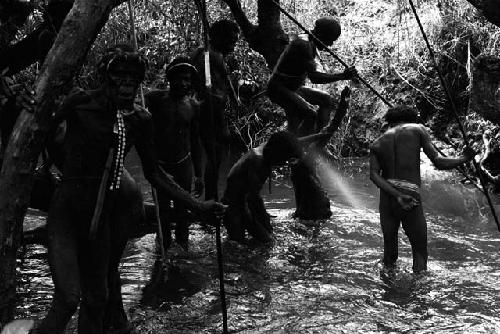 Men gathering for Etai - wade down into the Aikhé