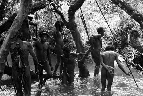 Men gathering for Etai - wade down into the Aikhé