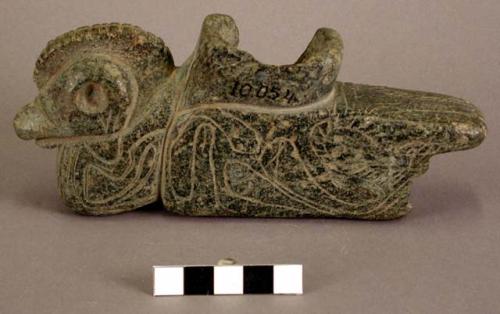 Ground stone pipe, effigy, animal, engraved