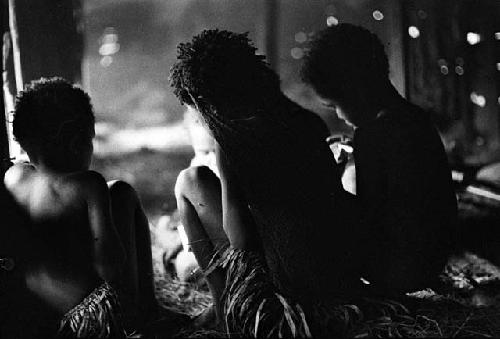 Children sitting; two little girls in foreground