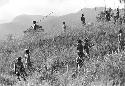 Men coming back up onto the hill on the end of the Warabara