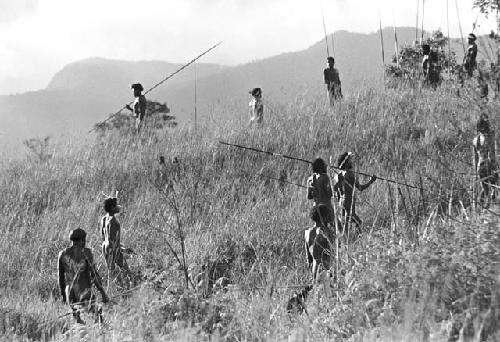 Men coming back up onto the hill on the end of the Warabara