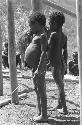 2 little children watch as the building goes up; Kibit Silimo; RC school