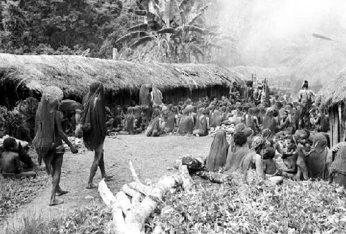 People entering the funeral; Karl Heider to the left