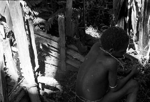 Okal in back of the sili in the banana trees near the waroleget; one of the boys who was with Weake