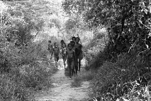 Children running down the path