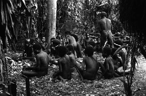 Back sili at Abukulmo; children eating after the wamkanneke