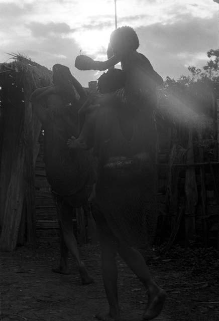 Women leaving the sili of Haliole in Abulupak