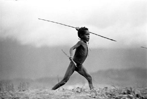 Uwar about to throw a spear