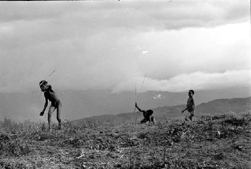 Boys throwing spears