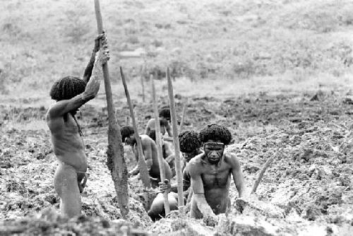 Men clearing a ditch