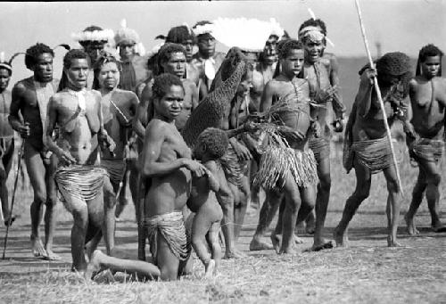 Women dancing on the Liberek; child nurses