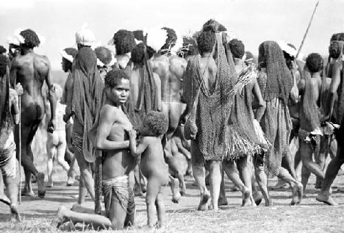 Women dancing on the Liberek; child nurses