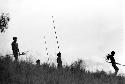 Men watch the war on the top of the end of the Warabara