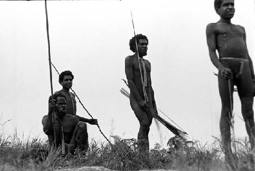 Men watch the war on the top of the end of the Warabara