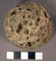 Stone ball. spherical cobble. ceremonial, game, or other use. vesicular basalt.
