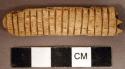 Organic, worked animal bone, rib fragment, incised and cut at one end