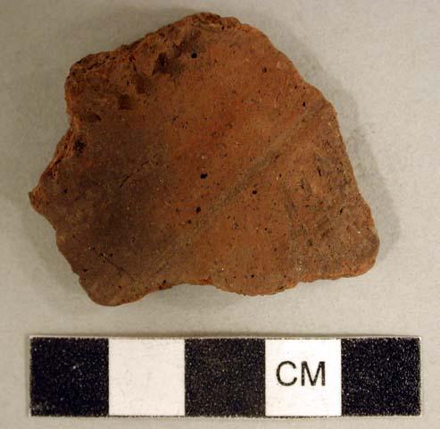 Coarse earthenware body sherd, incised, rocker dentate, punctate