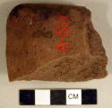 Ground stone, edged tool fragment, possibly axe or adze