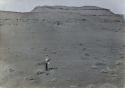 Man searching for graves at a ruin on Little Colorado River