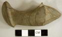 Ground stone, worked and polished perforated object fragment, possible atlatl weight