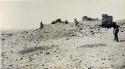 Man standing near ruins of church at Awatubi