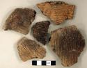 Ceramic, earthenware rim and body sherds, cord-impressed, grit-tempered; four sherds crossmend