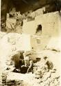 Cliff Palace ruins, two men in foreground