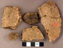 Coarse earthenware body sherds, some undecorated, one cord impressed, one incised