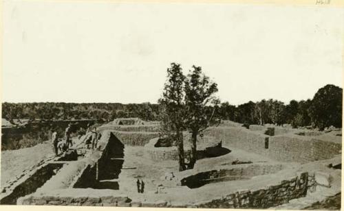 Ruins of Sun Temple, shows five men working on excavation