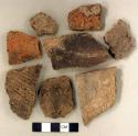 Coarse earthenware body and rim sherds, some cord impressed; non-cultural stone fragments
