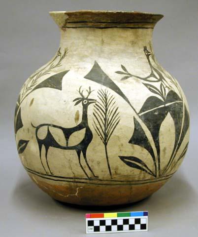 Pottery olla. Flaring rim, greyish-cream slip decorated in black. Deer forms e