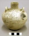 Ceramic vessel, short neck, 2 handles, brown on white exterior design.