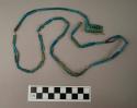 Necklace, pottery, blue-green tubular beads in double strand